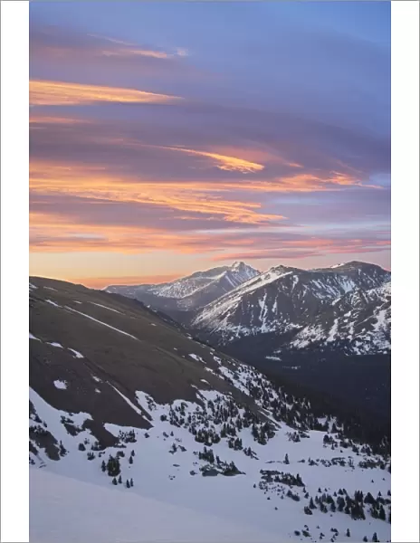 Orange clouds at dawn above Longs Peak