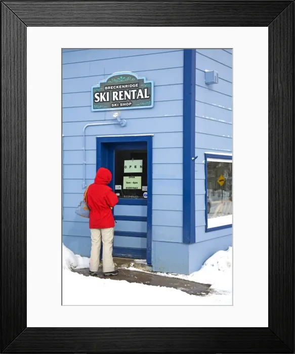 Framed Print : Woman entering ski rental store Framed Print : Woman entering ski rental store