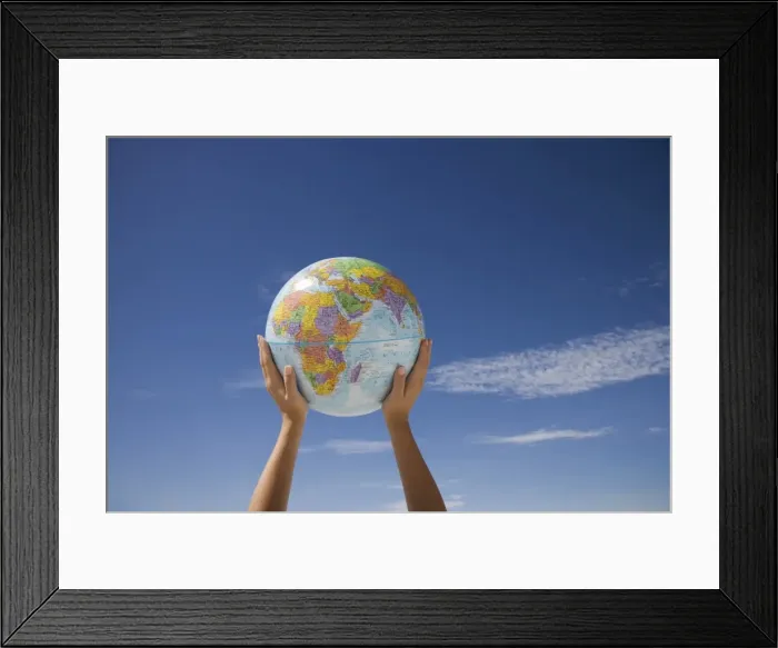 Framed Print : Womans hands holding globe Framed Print : Womans hands holding globe