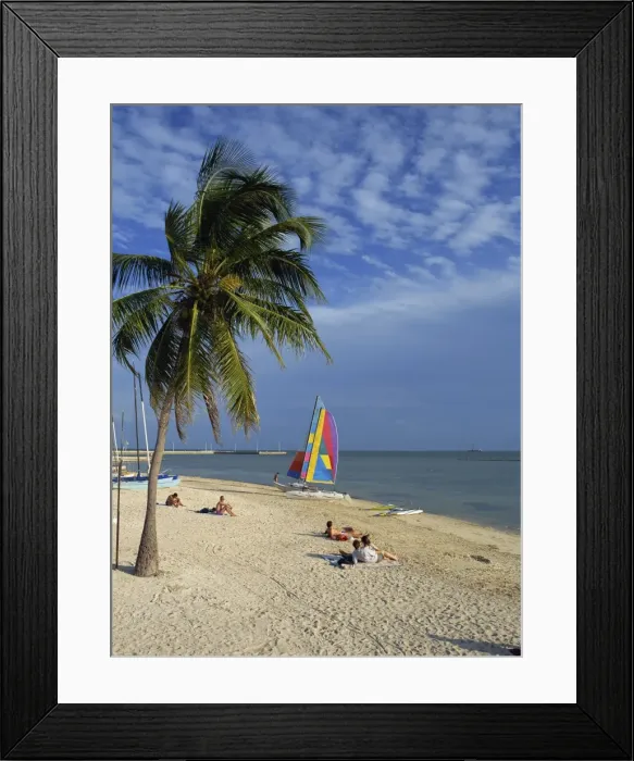 Framed Print : People on the beach in the late afternoon Framed Print : People on the beach in the late afternoon