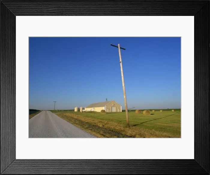 Framed Print : Telegraph pole and flat farm landscape with barn Framed Print : Telegraph pole and flat farm landscape with barn