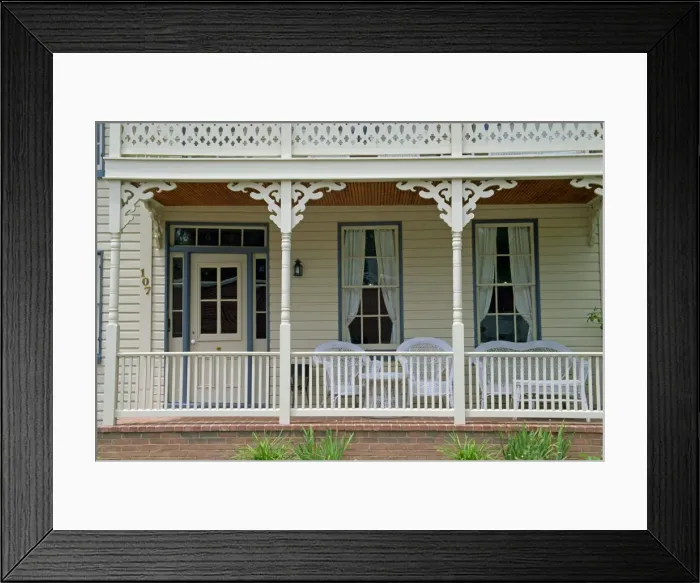 Framed Print : Close-up of brick and wood verandah of a building in St Framed Print : Close-up of brick and wood verandah of a building in St