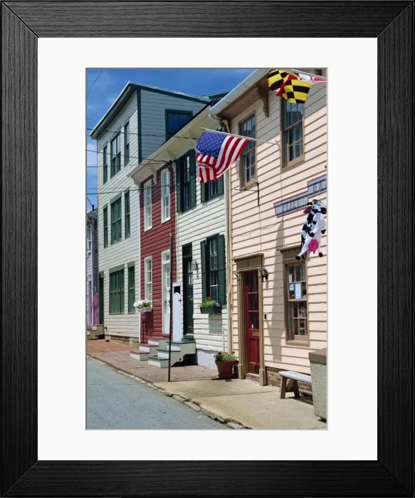 Framed Print : American flag on wooden buildings on a street in Annapolis Framed Print : American flag on wooden buildings on a street in Annapolis