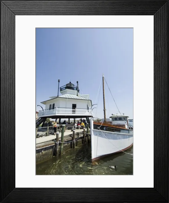 Framed Print : Typical historic lighthouse rescued and brought to Framed Print : Typical historic lighthouse rescued and brought to