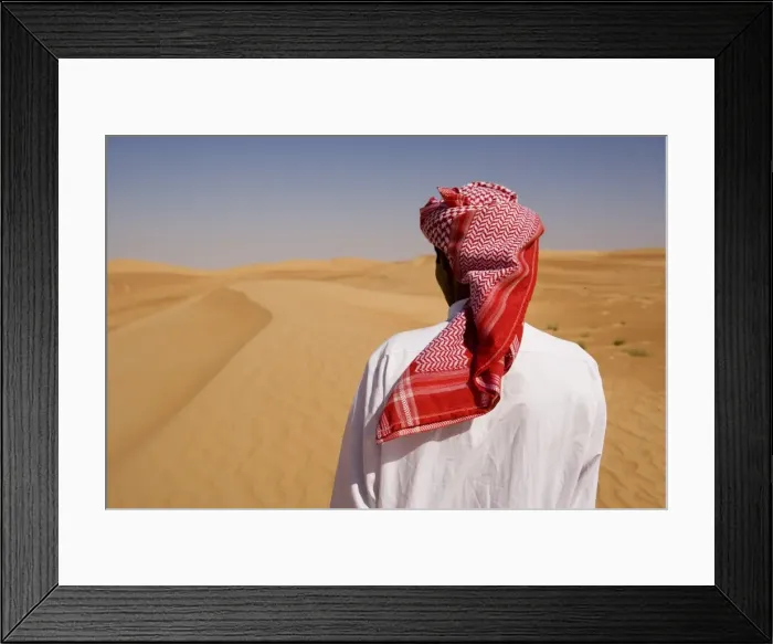 Framed Print : Man in traditional dress in the desert outside Dubai Framed Print : Man in traditional dress in the desert outside Dubai