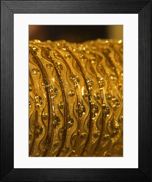 Framed Print : Close up of gold bangles on display Framed Print : Close up of gold bangles on display