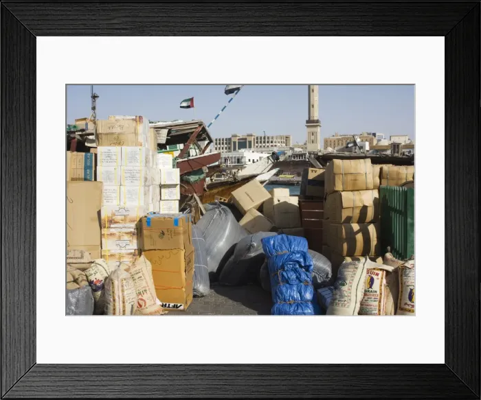 Framed Print : Goods on dock waiting to be loaded onto dhows for transportation Framed Print : Goods on dock waiting to be loaded onto dhows for transportation