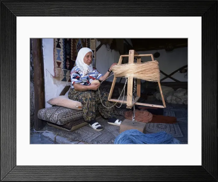 Framed Print : Woman gathering dyed wool in carpet workshop Framed Print : Woman gathering dyed wool in carpet workshop