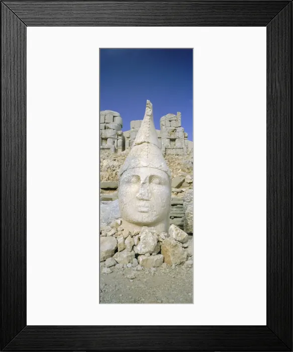Framed Print : Ancient carved stone heads