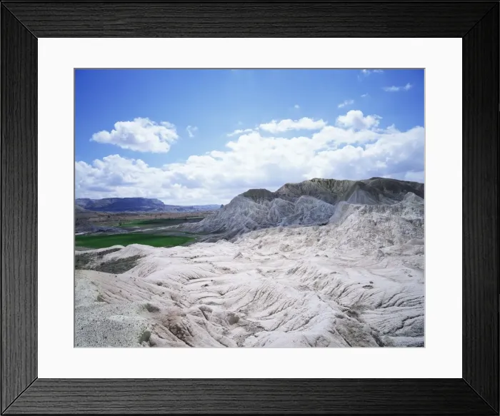 Framed Print : Rocks and green fields in distance Framed Print : Rocks and green fields in distance