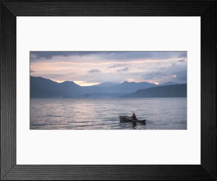 Framed Print : Fisherman in a fishing boat on Lake Toba (Danau Toba) at sunrise, North Sumatra, Indonesia