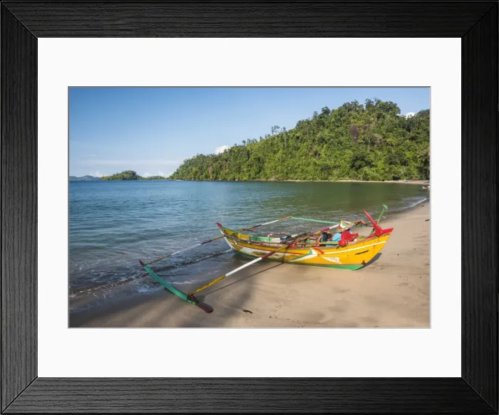 Framed Print : Traditional Indonesian fishing boat on the beach at Sungai Pinang Fishing Village