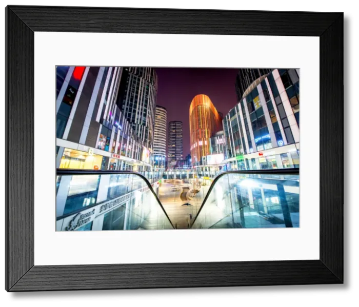Framed Print : Escalator railings and illuminated futuristic architecture at Sanlitun SOHO, Beijing Framed Print : Escalator railings and illuminated futuristic architecture at Sanlitun SOHO, Beijing