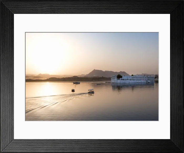 Framed Print : Boat going out to Lake Palace Hotel at dusk, the hotel is situated in the middle of Lake Pichola Framed Print : Boat going out to Lake Palace Hotel at dusk, the hotel is situated in the middle of Lake Pichola