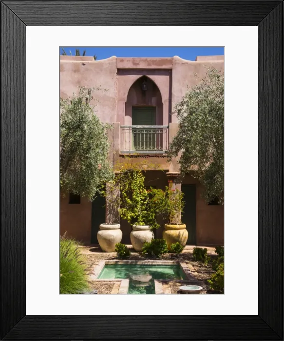 Framed Print : Typical Moroccan architecture, riad adobe walls, fountain and flower pots, Morocco Framed Print : Typical Moroccan architecture, riad adobe walls, fountain and flower pots, Morocco
