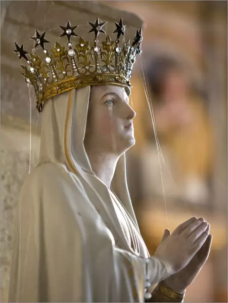 Statue of Virgin Mary wearing crown inside parish church, Saint-Thegonnec, Finistere