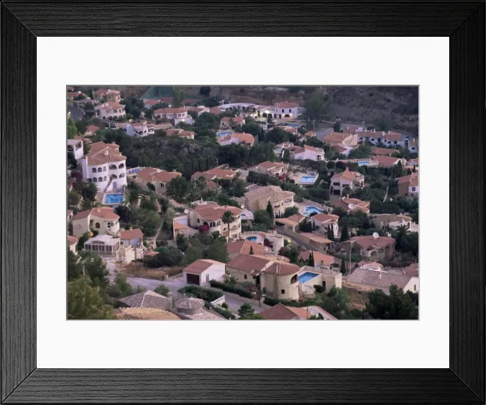 Framed Print : Elevated view of villa development on hillside Framed Print : Elevated view of villa development on hillside