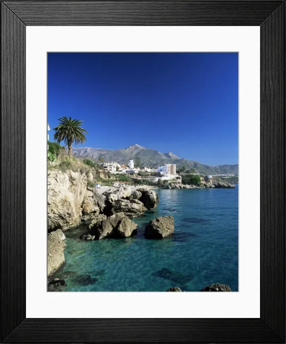 Framed Print : View along rock coast to town and mountains Framed Print : View along rock coast to town and mountains