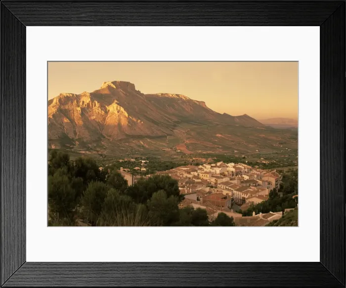 Framed Print : Velez Blanco nestled beneath the rocky peak of La Muela at sunset Framed Print : Velez Blanco nestled beneath the rocky peak of La Muela at sunset