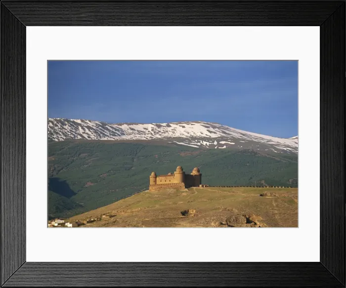 Framed Print : View to distant medieval castle beneath the snow-capped Sierra Nevada Framed Print : View to distant medieval castle beneath the snow-capped Sierra Nevada