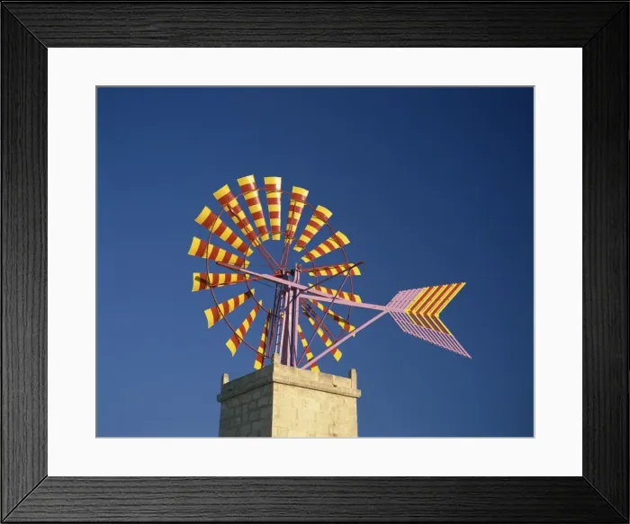 Framed Print : Windmill with sails in the colours of the Mallorcan flag Framed Print : Windmill with sails in the colours of the Mallorcan flag