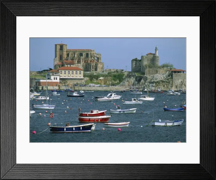 Framed Print : Boats moored in harbour and the 12th century church of Santa Maria Framed Print : Boats moored in harbour and the 12th century church of Santa Maria