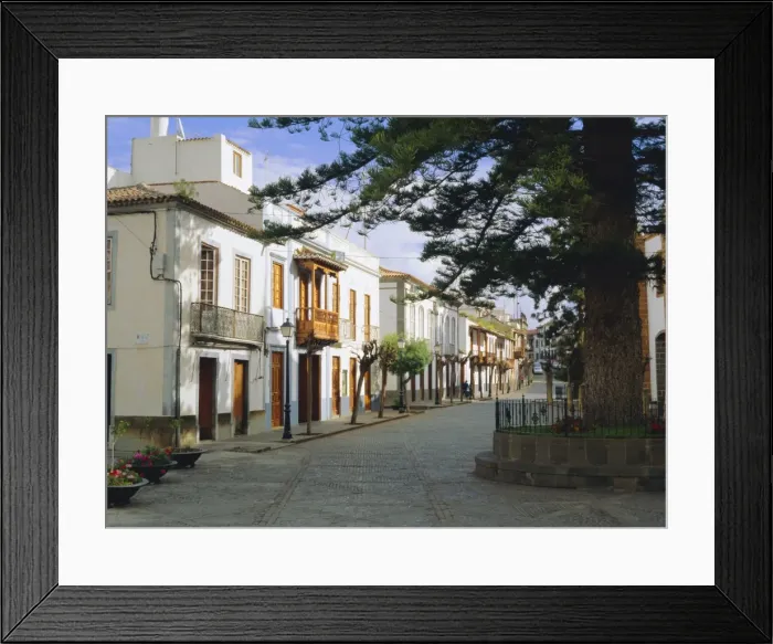 Framed Print : Town houses with beautiful wooden balconies in the center of Teror Framed Print : Town houses with beautiful wooden balconies in the center of Teror