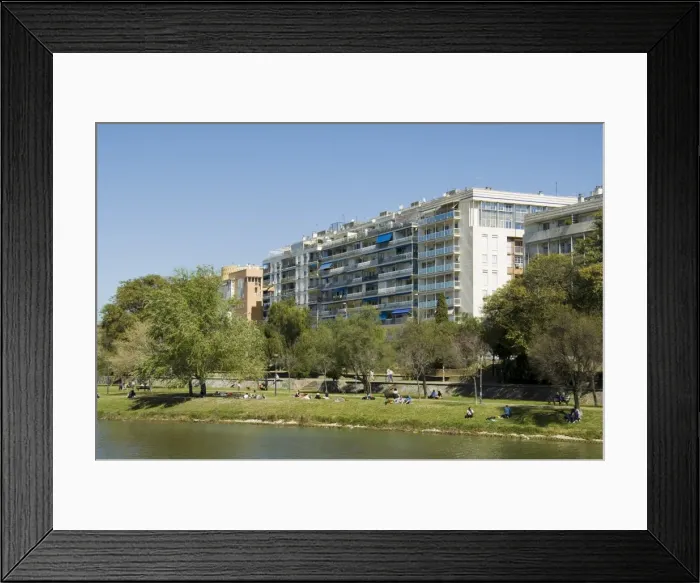 Framed Print : Modern apartment blocks on the river Rio Guadalquivir