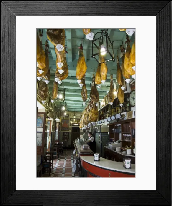 Framed Print : Tapas bar and restaurant with hams hanging from the ceiling Framed Print : Tapas bar and restaurant with hams hanging from the ceiling