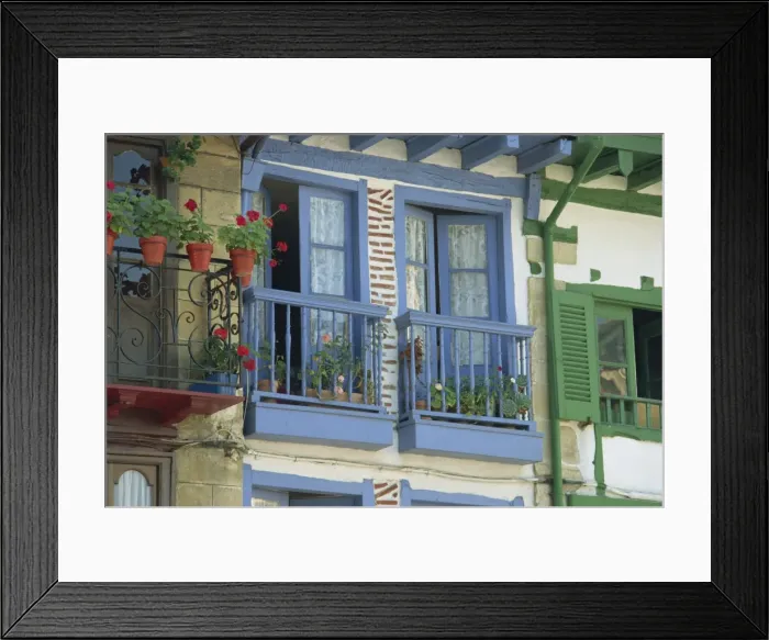 Framed Print : Close-up of balconies and windows painted blue and green Framed Print : Close-up of balconies and windows painted blue and green