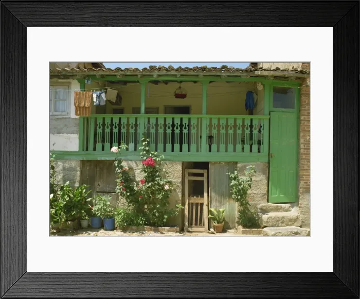 Framed Print : Detail of the exterior of a house with a green door and woodwork Framed Print : Detail of the exterior of a house with a green door and woodwork
