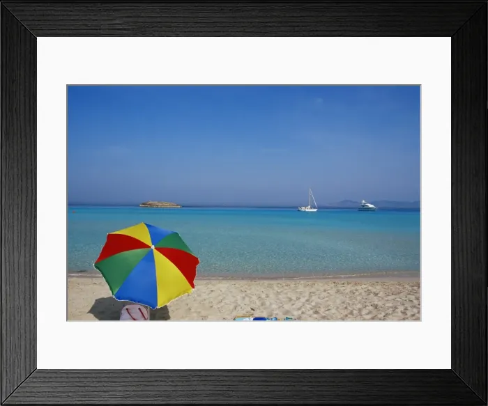 Framed Print : Colourful umbrella on Playa de ses Illetes beach Framed Print : Colourful umbrella on Playa de ses Illetes beach