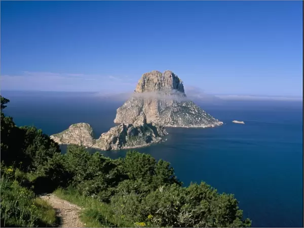 The rocky islet of Es Vedra surrounded by mist