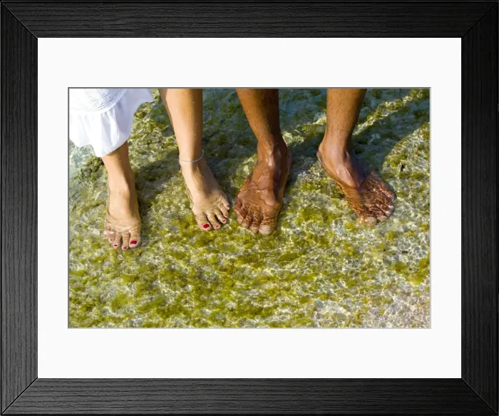 Framed Print : Feet in sea water