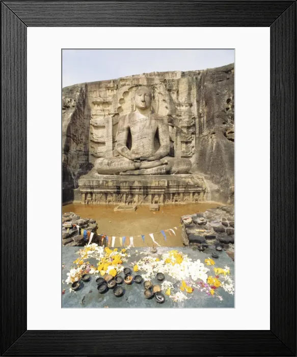 Framed Print : Seated Buddha statue with offerings Framed Print : Seated Buddha statue with offerings