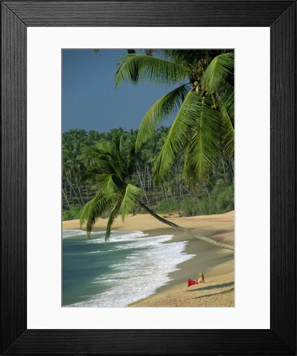 Framed Print : Woman relaxing on empty beach Framed Print : Woman relaxing on empty beach