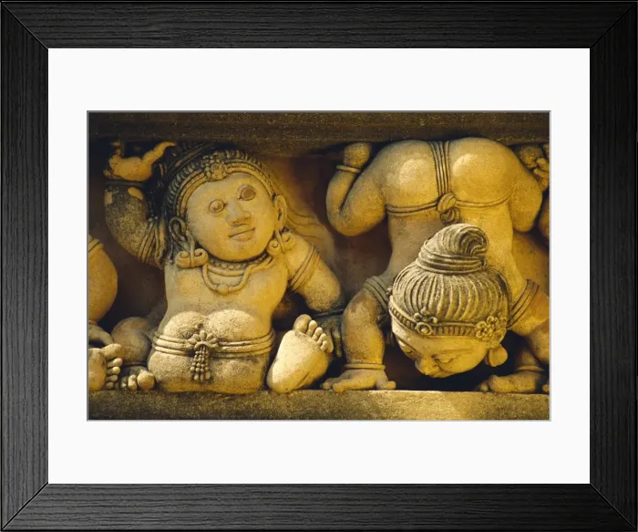 Framed Print : Dwarf carvings line temple wall