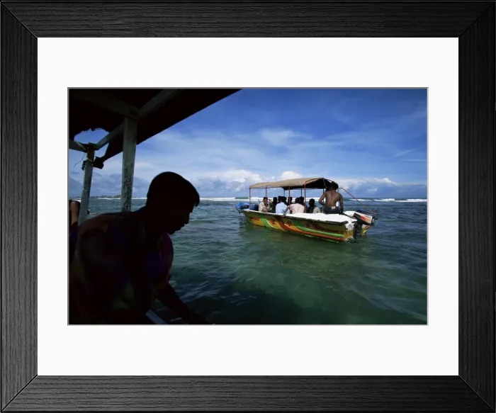 Framed Print : Glass bottom boats near Hikkaduwa taking tourists to Framed Print : Glass bottom boats near Hikkaduwa taking tourists to