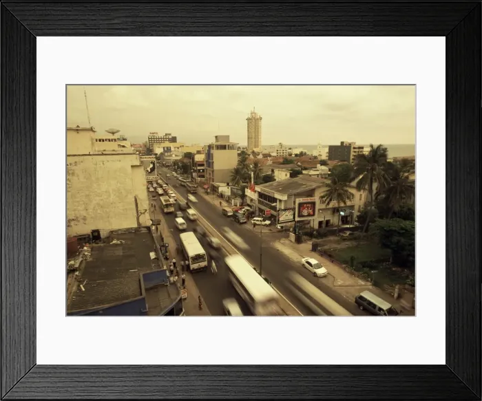 Framed Print : Traffic in Colombo beneath monsoon skies