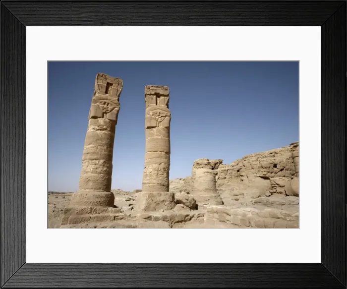 Framed Print : Carved pillars stand at the entrance to the Temple Framed Print : Carved pillars stand at the entrance to the Temple