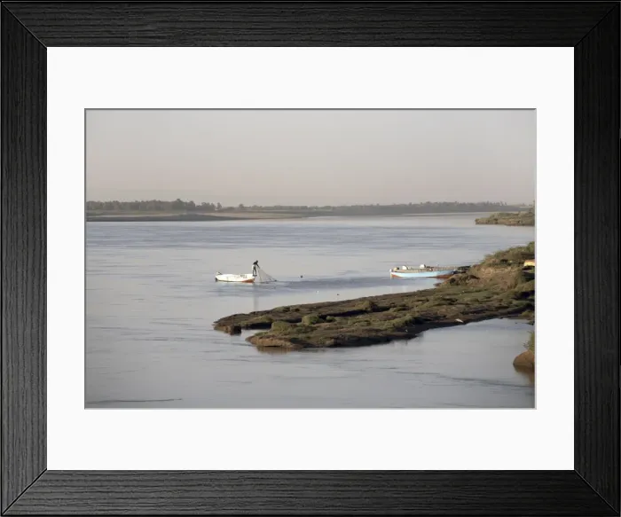 Framed Print : A fisherman checks his nets on the Nile river at Karima Framed Print : A fisherman checks his nets on the Nile river at Karima