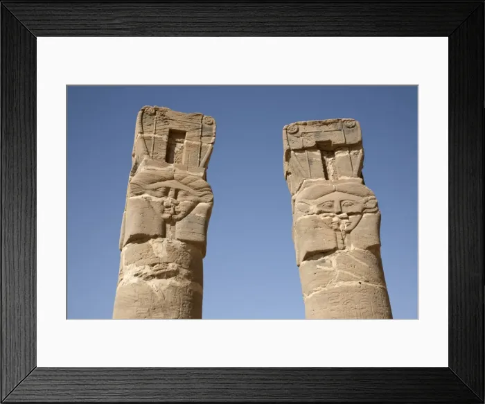 Framed Print : Carved pillars stand at the entrance to the Temple Framed Print : Carved pillars stand at the entrance to the Temple