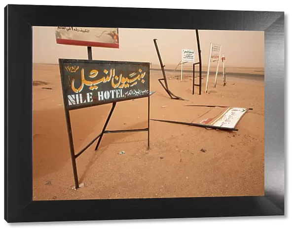 Signposts stand in the desert along the Khartoum to Atbara highway