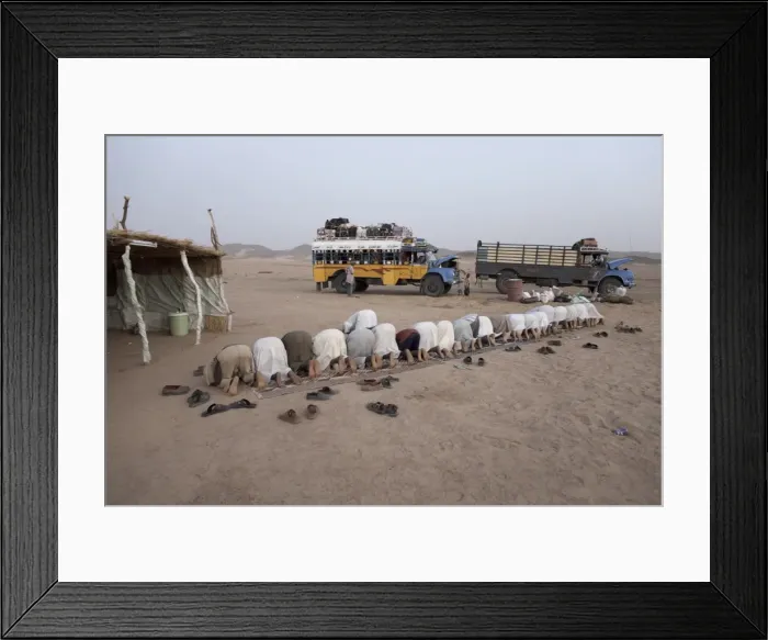 Framed Print : Muslims stop in the Nubian Desert for evening prayers Framed Print : Muslims stop in the Nubian Desert for evening prayers