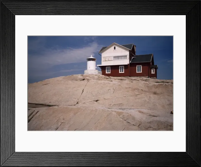 Framed Print : Lighthouse on Stora Svangen at entrance to Kosterfjord Framed Print : Lighthouse on Stora Svangen at entrance to Kosterfjord