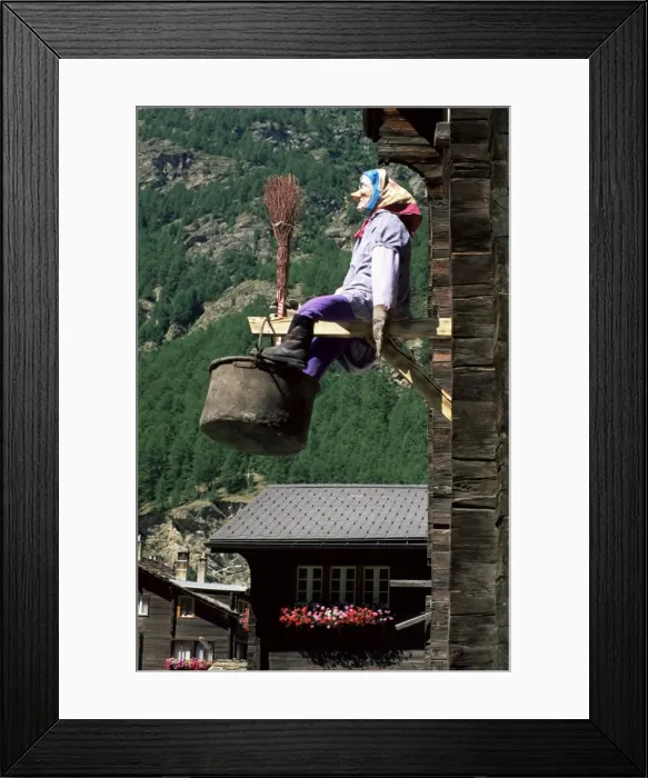 Framed Print : Witch hanging outside village house Framed Print : Witch hanging outside village house
