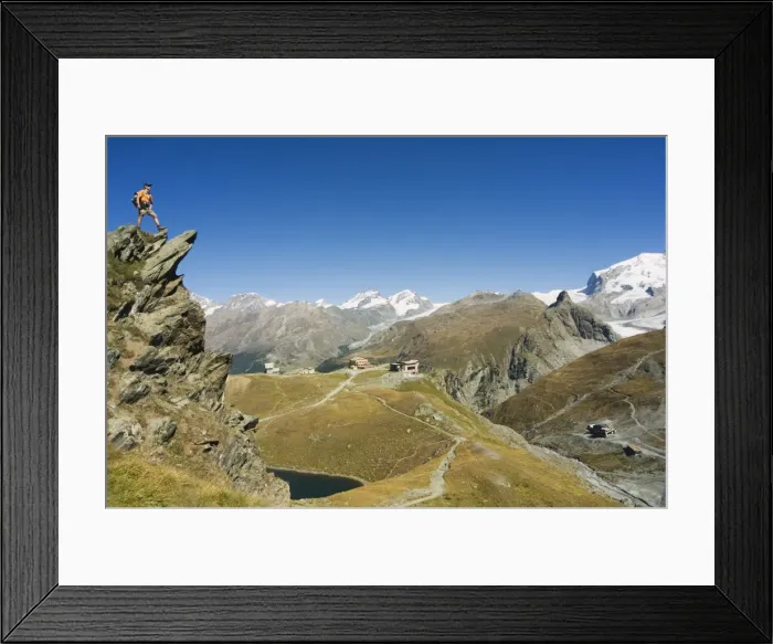 Framed Print : Hiker on trail above lake at Schwarzee Paradise Framed Print : Hiker on trail above lake at Schwarzee Paradise