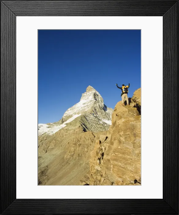 Framed Print : Hiker on trail celebrating at the sight of the Matterhorn Framed Print : Hiker on trail celebrating at the sight of the Matterhorn