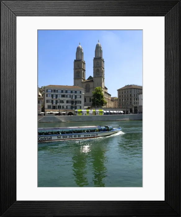 Framed Print : Sightseeing boat on the River Limmat in front of Grossmunster church Framed Print : Sightseeing boat on the River Limmat in front of Grossmunster church