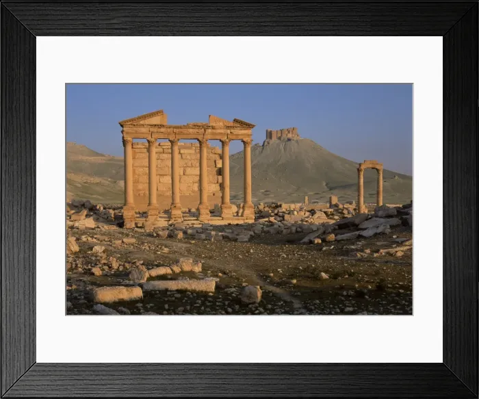 Framed Print : Funerary temple at archaeological site and Arab castle beyond Framed Print : Funerary temple at archaeological site and Arab castle beyond
